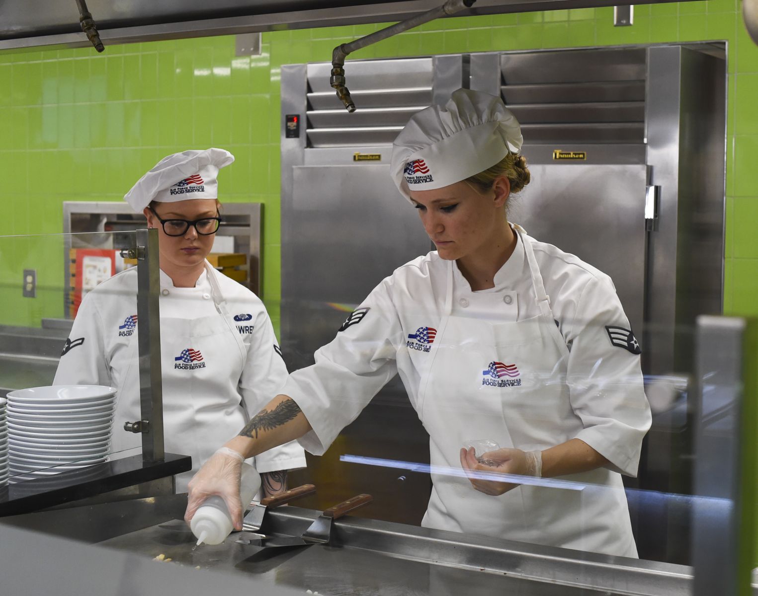 Food service workers serve patrons of Joint Base Charleston's newly renovated Gaylor Dining Facility. (Photo/Joint Base Charleston)