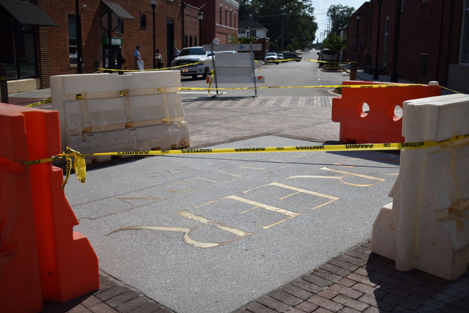 By July 2, the centerpiece inlay at the intersection of Trade and Randall Street had been installed and was blocked off from traffic. (Photo/Molly Hulsey)