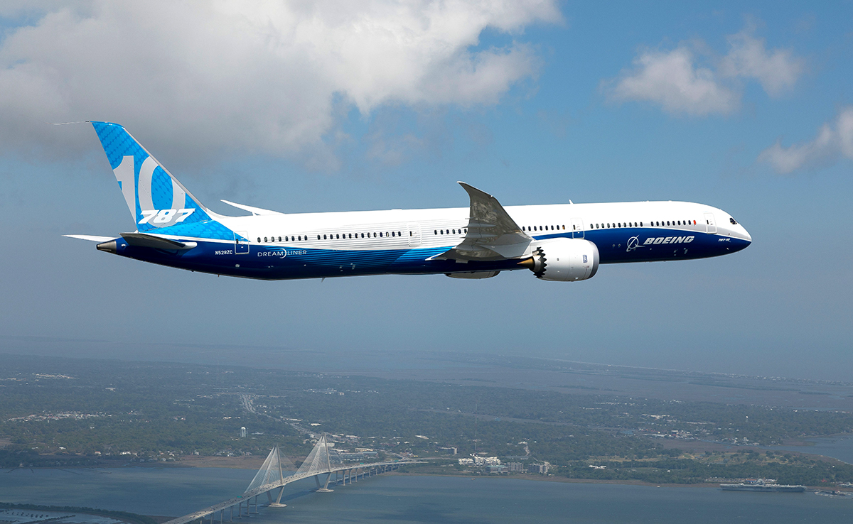 A 787-10 Dreamliner flies over the Cooper River. (Photo/Boeing Co.)