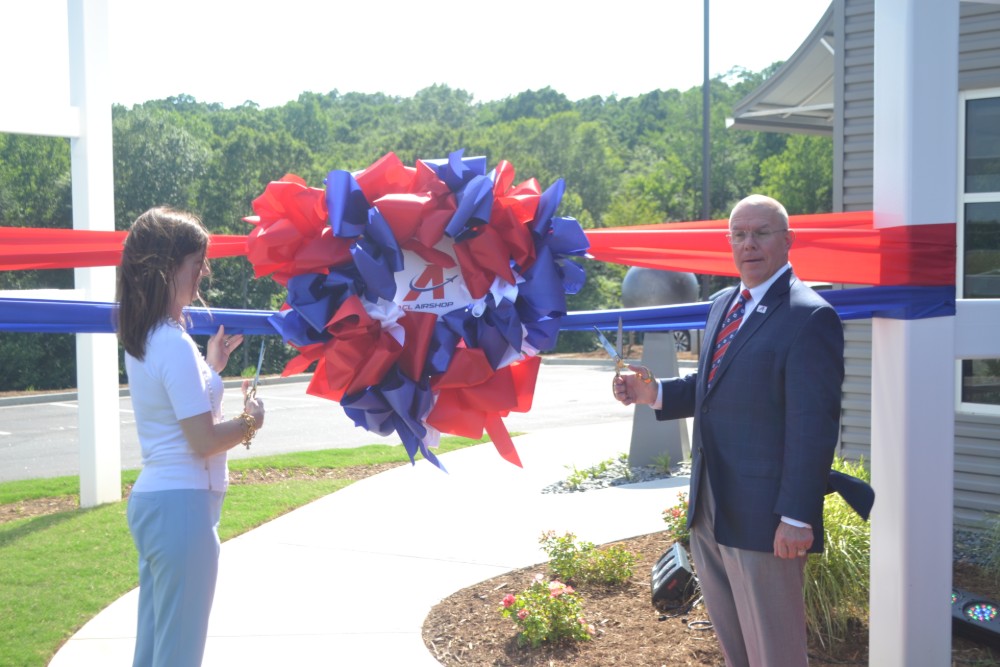 S.C. Lt. Gov. Pamela Evette takes care of ribbon-cutting duties with ACL Airshop CEO Steve Towned. (Photo/Ross Norton)