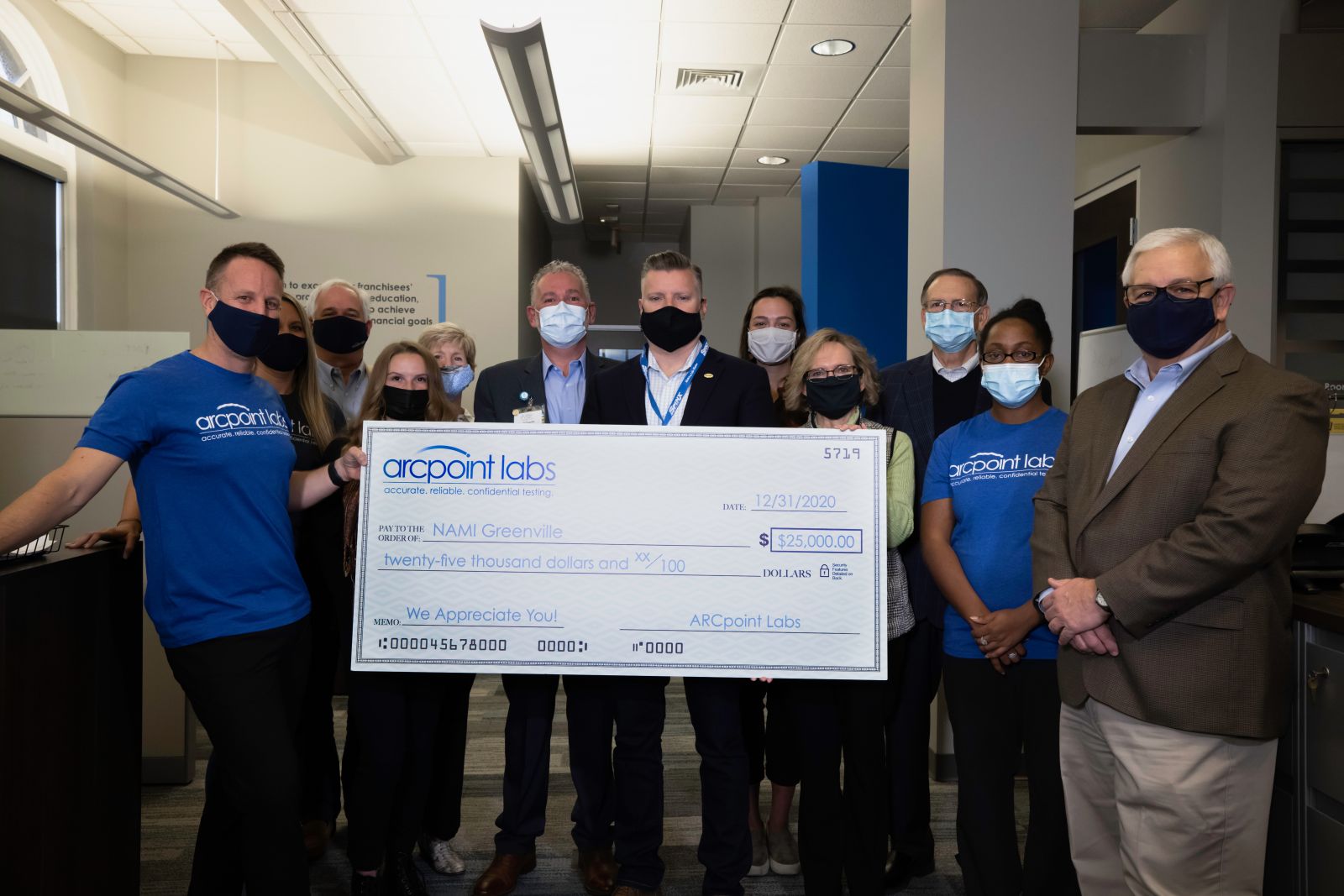 Representatives from ARCpoint Labs and NAMI Greenville met on Dec. 31 for the $25,000 check presentation (Photo/Provided)