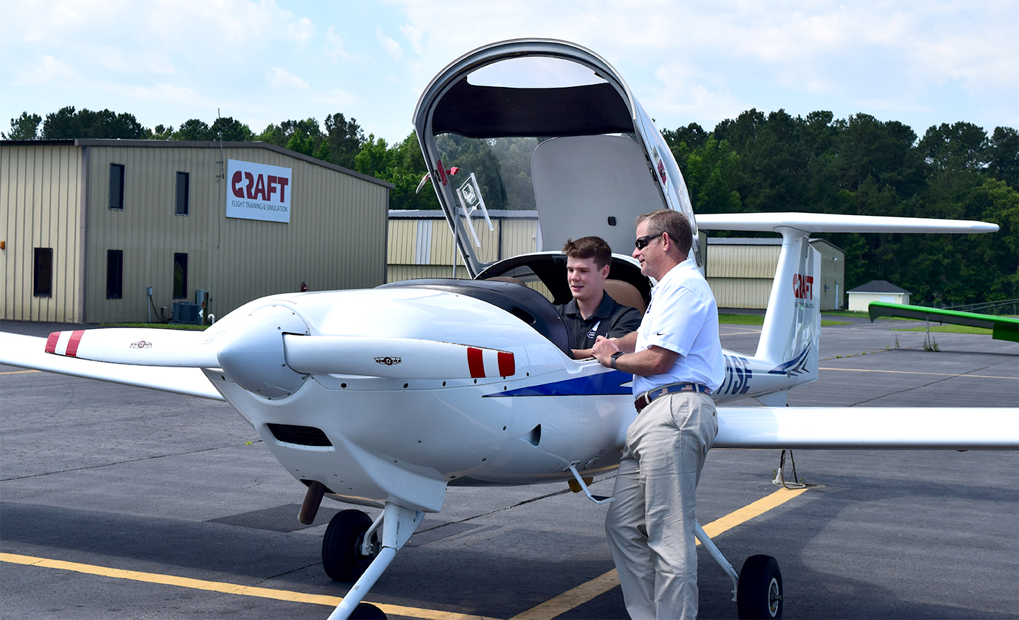Harrison Hunt, Charleston South University student, and Col. CJ Will, founding chair of CSU‰ŰŞs Aeronautics Department, discuss flight logistics at the Summerville Airport. (Photo/Teri Errico Griffis)