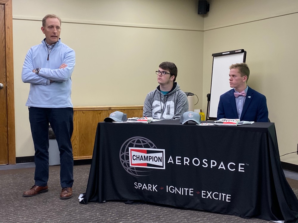 Jason Marlin, president of Champion Aerospace, said he started his career as an intern and welcomed the students, Trenton Riddle, left, and Steven Chappell, as youth apprentices at the company in Liberty. (Photo/Teresa Cutlip)