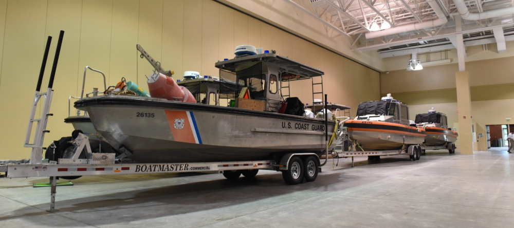 Twenty-six- and 29-foot response vessels sit on trailers at the Hurricane Dorian incident command post for Coast Guard Sector Charleston. The Coast Guard pre-stages and relocates personnel and assets to have a rapid post-storm response. (Petty Officer 2nd Class Michael Himes for the Coast Guard)