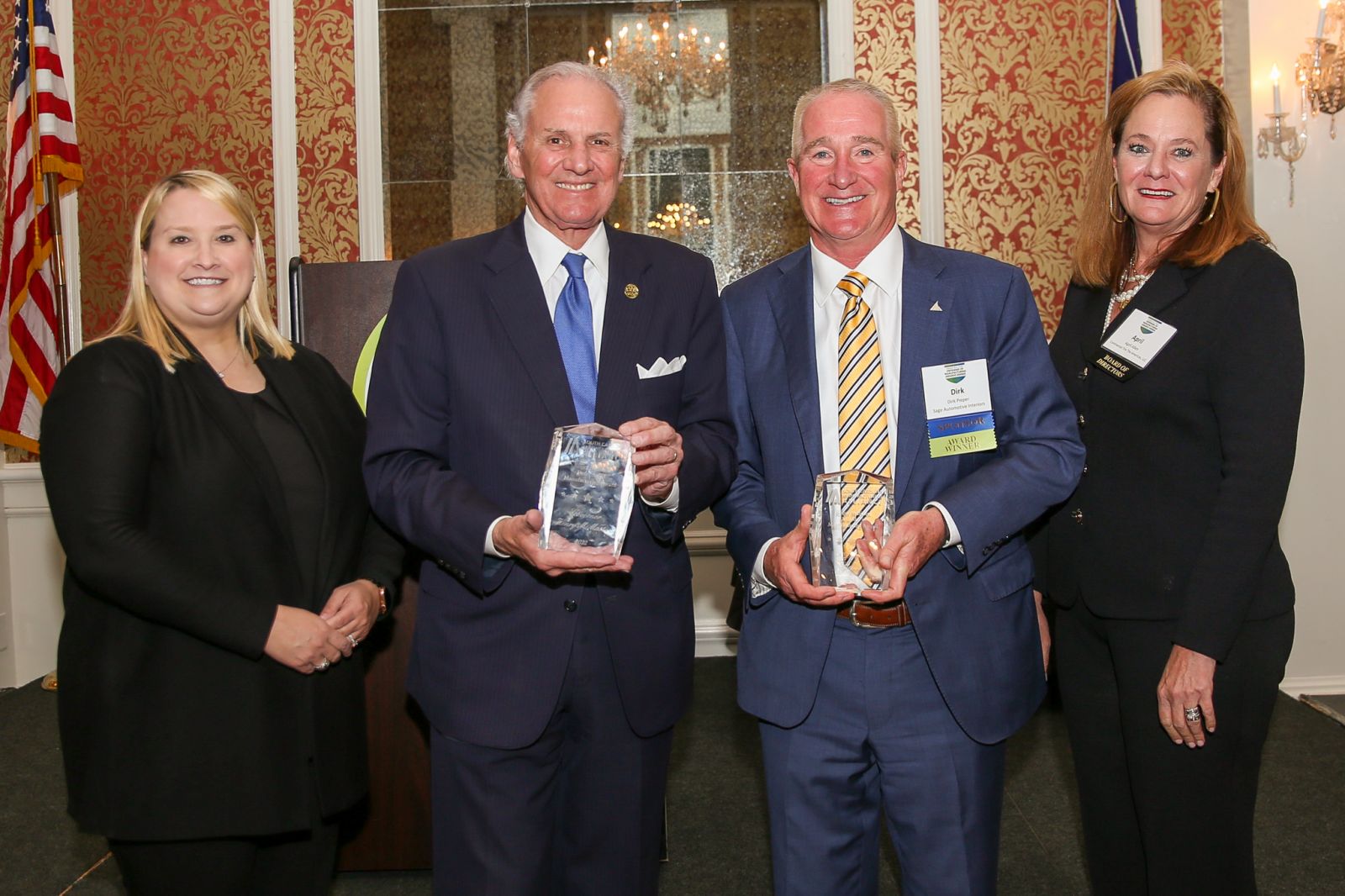  (Left to Right) Sara Hazzard, president and CEO of the South Carolina Manufacturers Alliance and April Allen, chair of the South Carolina Manufacturers Alliance and director of U.S. Government Relations with Continental (left to right) award Gov. Henry McMaster and Dirk Pieper, president and CEO of Sage Automotive Interiors. (Photo/Devin Steele) 