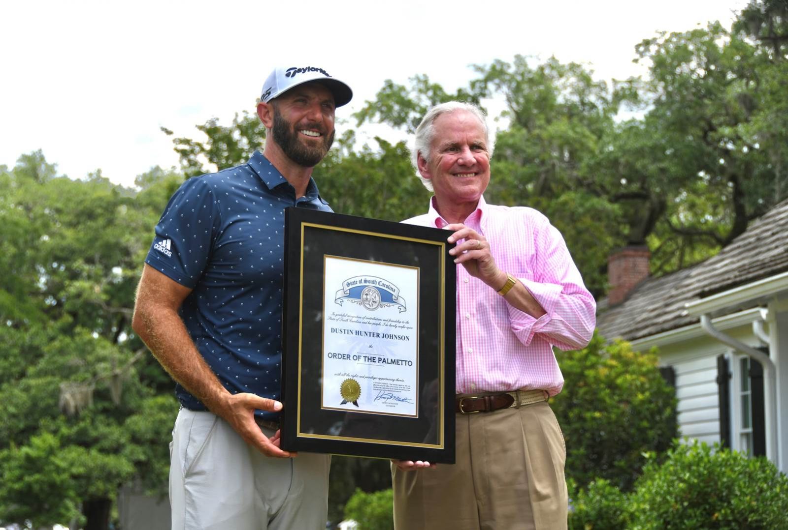 Dustin Johnson receives the Order of the Palmetto from Gov. Henry McMaster. (Photo/Congaree Golf Club)
