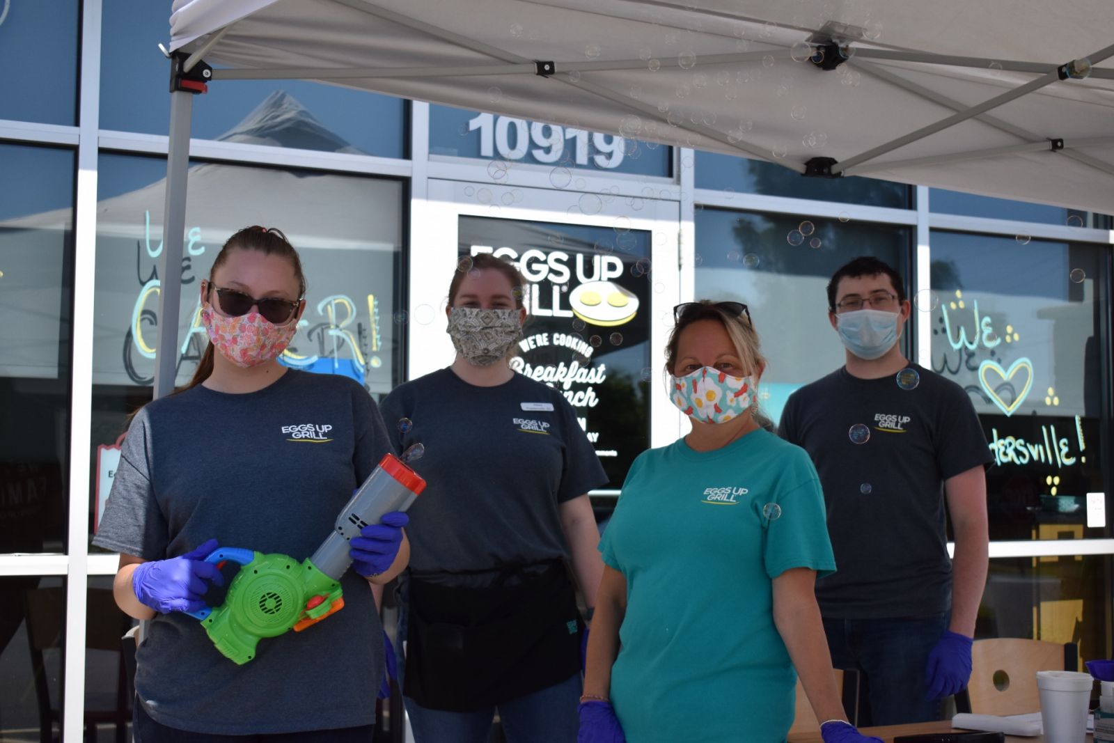 Eggs Up Grill's Powdersville team donned masks and loaded bubble guns to promote the restaurant's reopening in 2020. (Photo/Molly Hulsey)