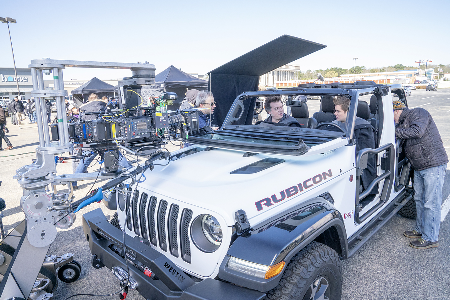 HBO film crews set up a shot for The Righteous Gemstones with actors Danny McBride (left) and Adam Devine in the At Home parking lot in North Charleston. (Photo/Fred Norris, HBO)