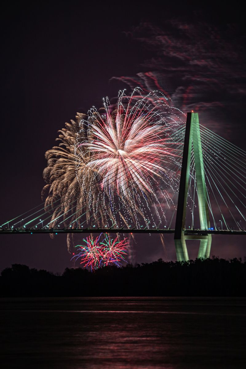 Fireworks explode above the Cooper River, illuminating the Ravenel Bridge in 2019. (Photo/Kim McManus)
