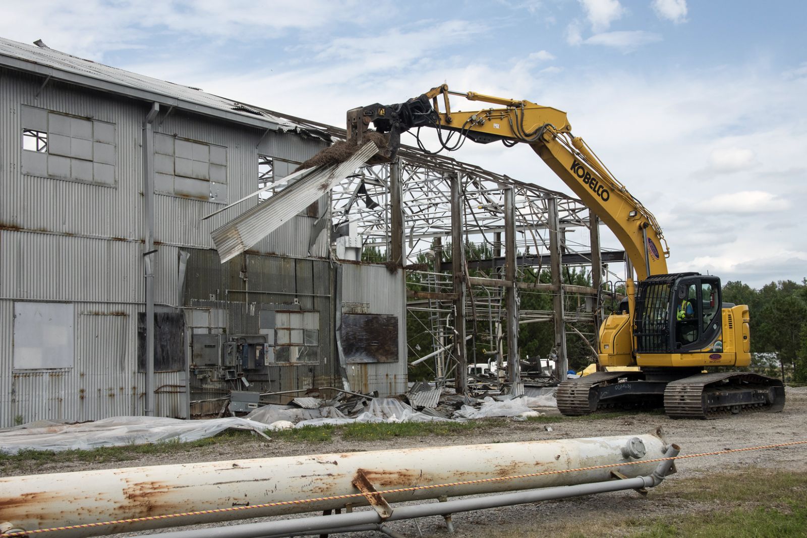 At the height of the Cold War, the Ford Building was used to test components used in five nuclear reactors at the Savannah River Site. An excavator is shown here removing a section of the facility‰ŰŞs metal roof. (Photo/Provided)