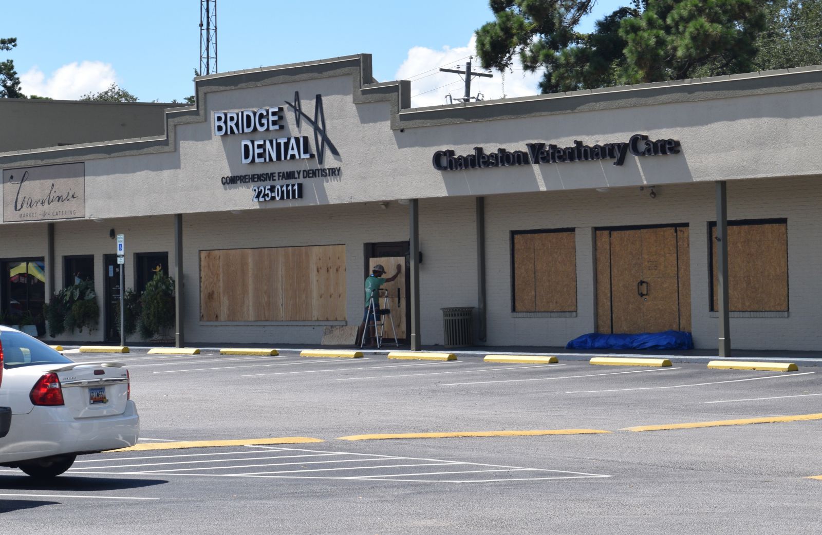 Lowcountry businesses continued to board up windows and place sandbags near doors Monday after an uncertain Labor Day weekend brought concerns of flooding and storm surge. (Photo/Jaclyn Bryson)
