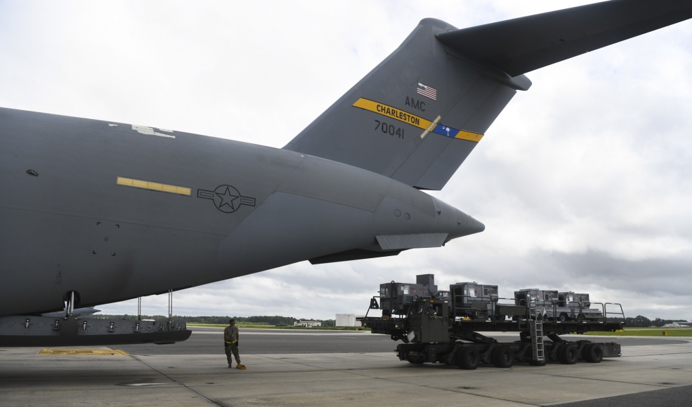 Charleston airmen load equipment onto a C-17 Globemaster III in preparation to evacuate aircraft Monday at Joint Base Charleston. (Photo/Senior Airman Cody R. Miller for U.S. Air Force)