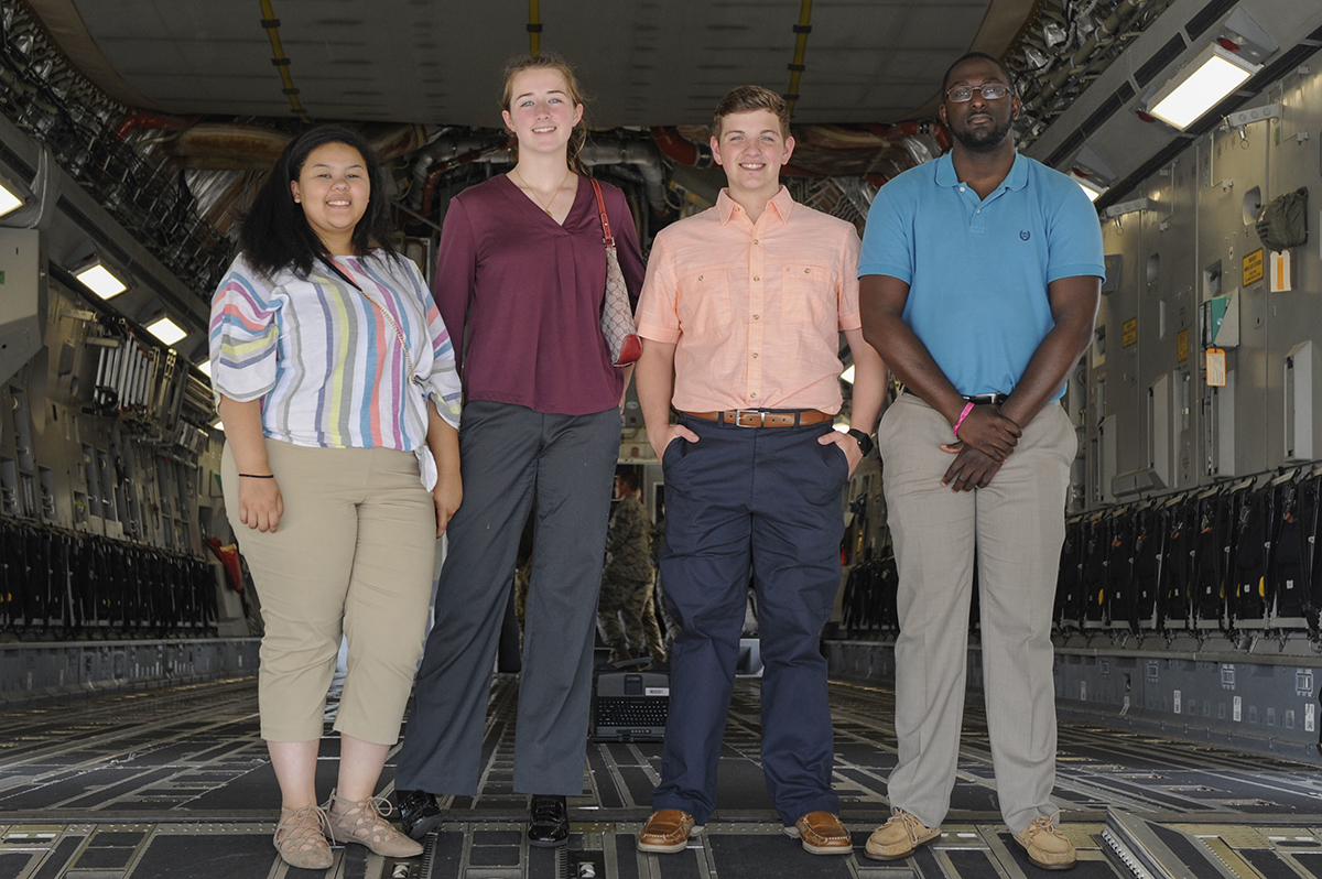 From left, Summer interns Rachel Higgins, Emma McBride, Aleric Stell and Brandon Harvey stand on the ramp of a C-17 Globemaster III during a tour of Joint Base Charleston earlier this month. (Photo/Senior Airman Thomas T. Charlton for the Air Force)