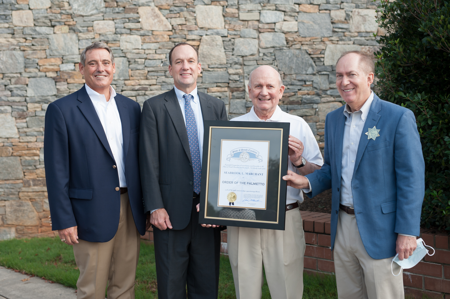  S.C. Sen. Ross Turner presented Seabrook Marchant, president and broker-in-charge of Marchant Real Estate and founder of LEAD, with the Order of the Palmetto Sept 18. (Photo/Provided)