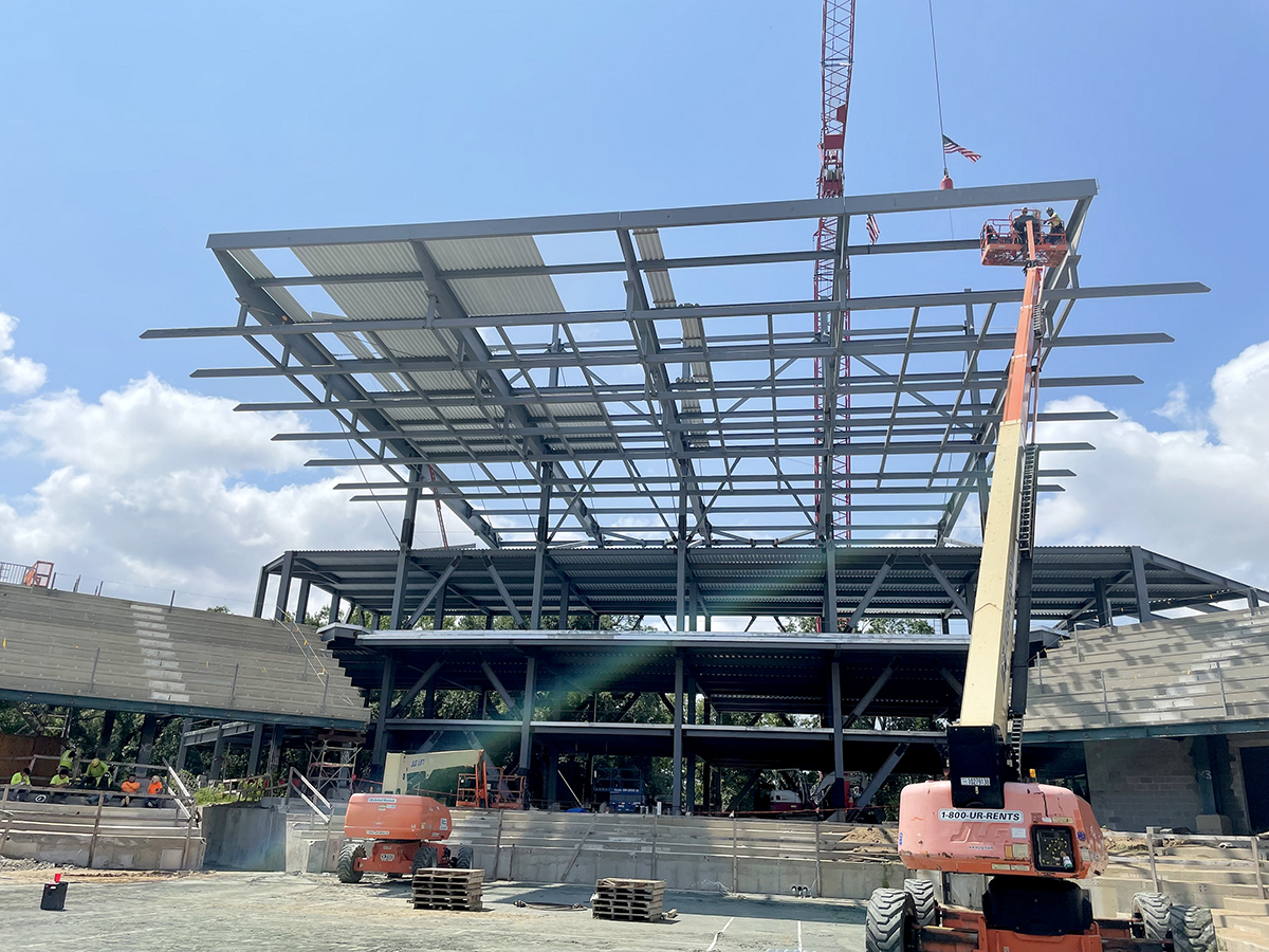 A last structural beam is lifted into place at the newly named Credit One Stadium by work crews from Choate Construction. The extensive renovation project is expected to be completed by spring next year. (Photo/Provided)