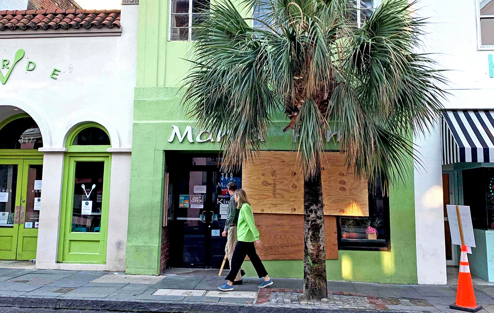Restaurants on King Street remained boarded up Sunday morning after some protesters broke windows and spray-painted walls, resulting in multiple days of curfews across the Lowcountry. (Photo/Shawnda Poynter)