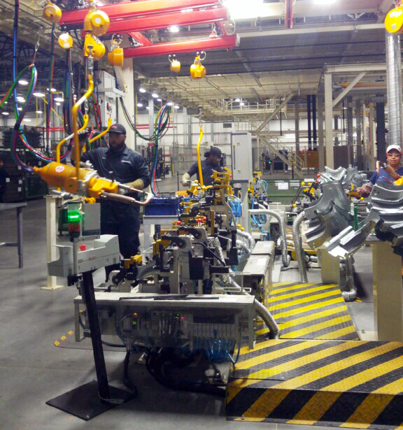 Employees work in the body shop at the Mercedes-Benz Vans campus in Ladson. (Photo/Kim McManus)