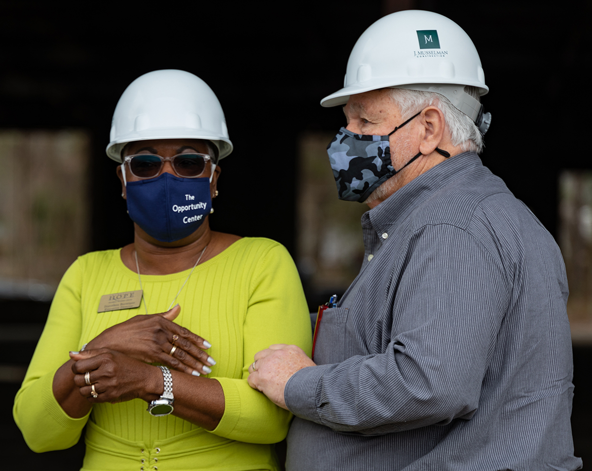 Dorothea Bernique, executive director of Increasing H.O.P.E., talks with North Charleston Mayor Keith Summey at the groundbreaking for the Opportunity Center. (Photo by Reggie Murphy/TMI Productions)