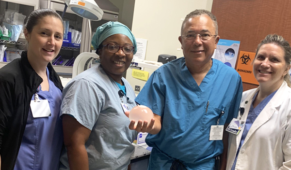 Nurse Kate Broderick (from left), endoscopy technician Candace Gaillard, Dr. Morris Washington and bariatric program navigator Karen Evanosky were part of the first Orbera procedure. Washington is holding one of the Orbera balloons.. (Photo/Provided)