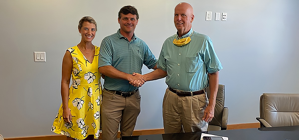 Palmetto Craftsmen general contracting has been sold to Zach King, the owner of Sand Creek Construction. From left, Virginia King, Zach King and John B. "Demi" Howard, previous owner of Palmetto Craftsmen, meet about the sale. (Photo/Provided)