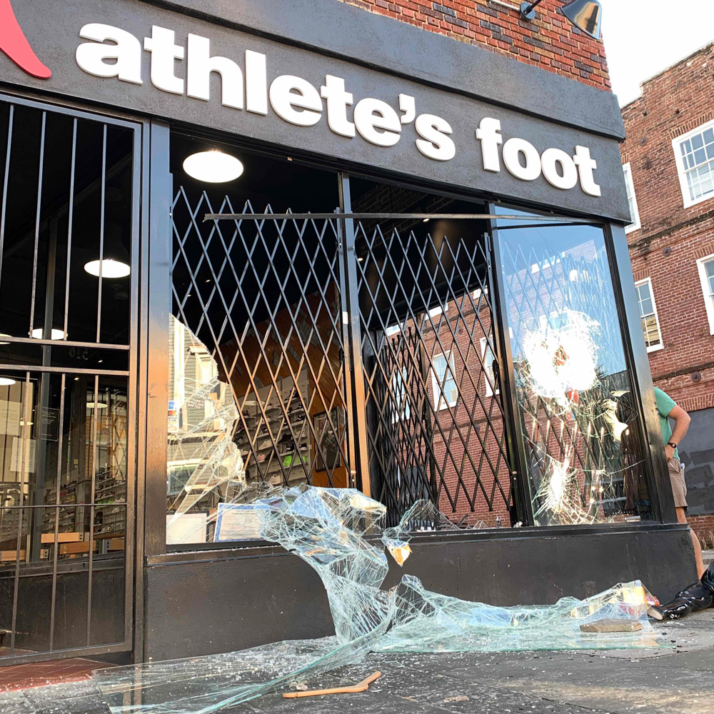 The Athlete's Foot on the corner of King and Reid streets was among many of the businesses damanged during civil unrest Saturday night in downtown Charleston. (Photo/Shawnda Poynter)