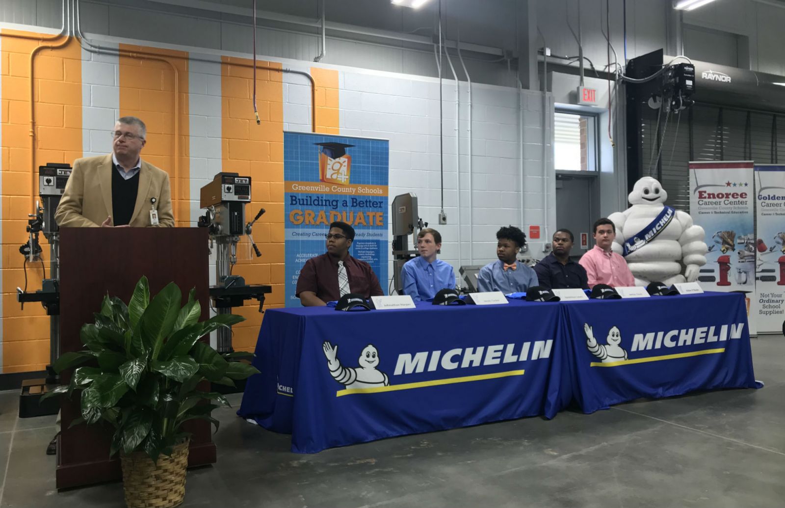 Michelin North America and Greenville County schools partnered for the Michelin Youth Apprenticeship program and held a signing day for the first five apprentices. From left, Burke Royster, superintendent of Greenville County schools, and apprentices Johnathan Harper, Jacob Tucker, Iquavious Lewis, Janias Tinch and Aidan O??Boyle. (Photo/Teresa Cutlip)