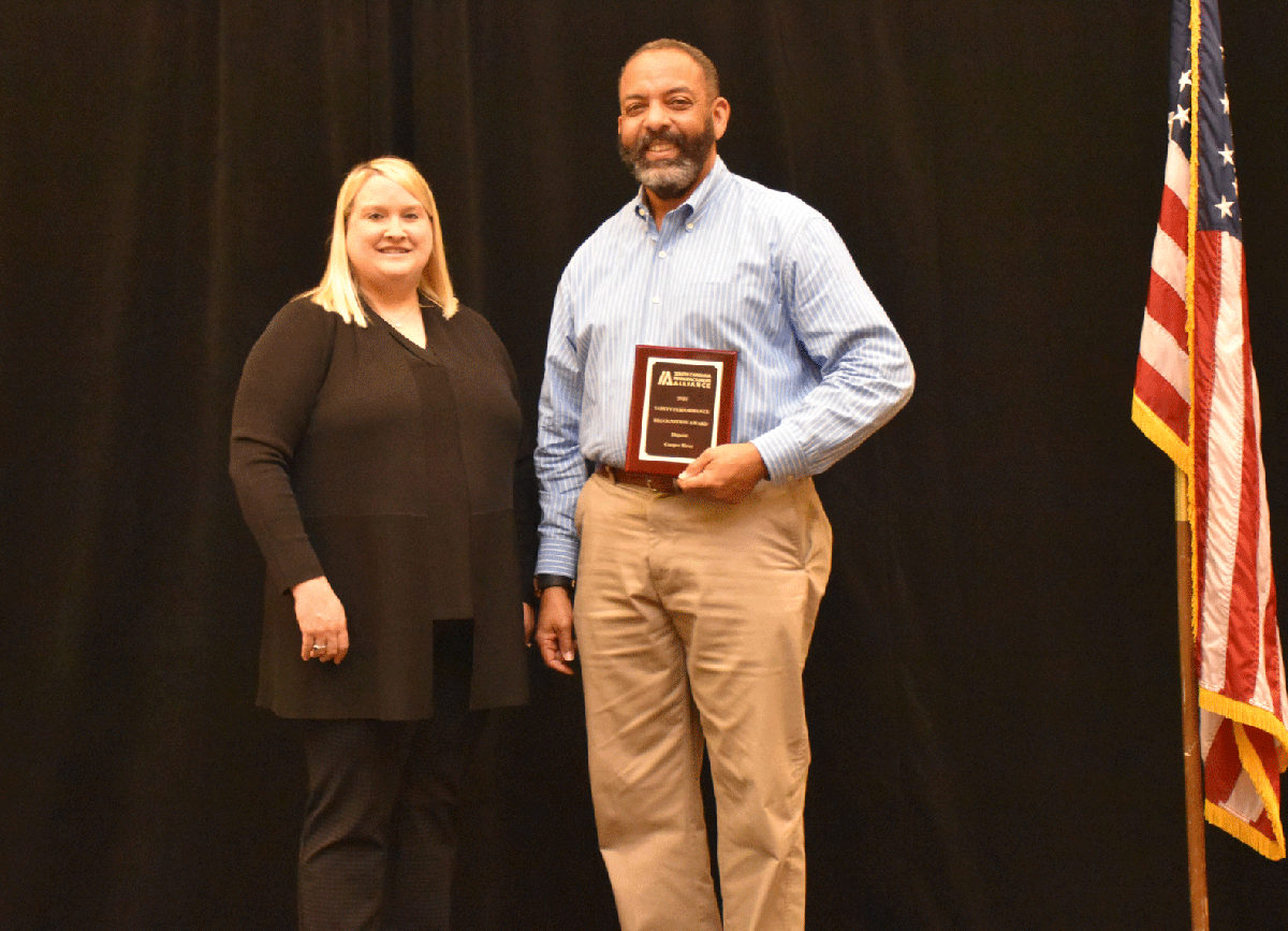 Sara Hazzard, S.C. Manufacturers Association president and CEO, presents a safety award to Keith Mitchell, senior environmental, health and safety specialist at DuPont. The Moncks Corner manufacturing company was one of 85 South Carolina workplaces recognized for prioritizing safety procedures. (Photo/Provided).