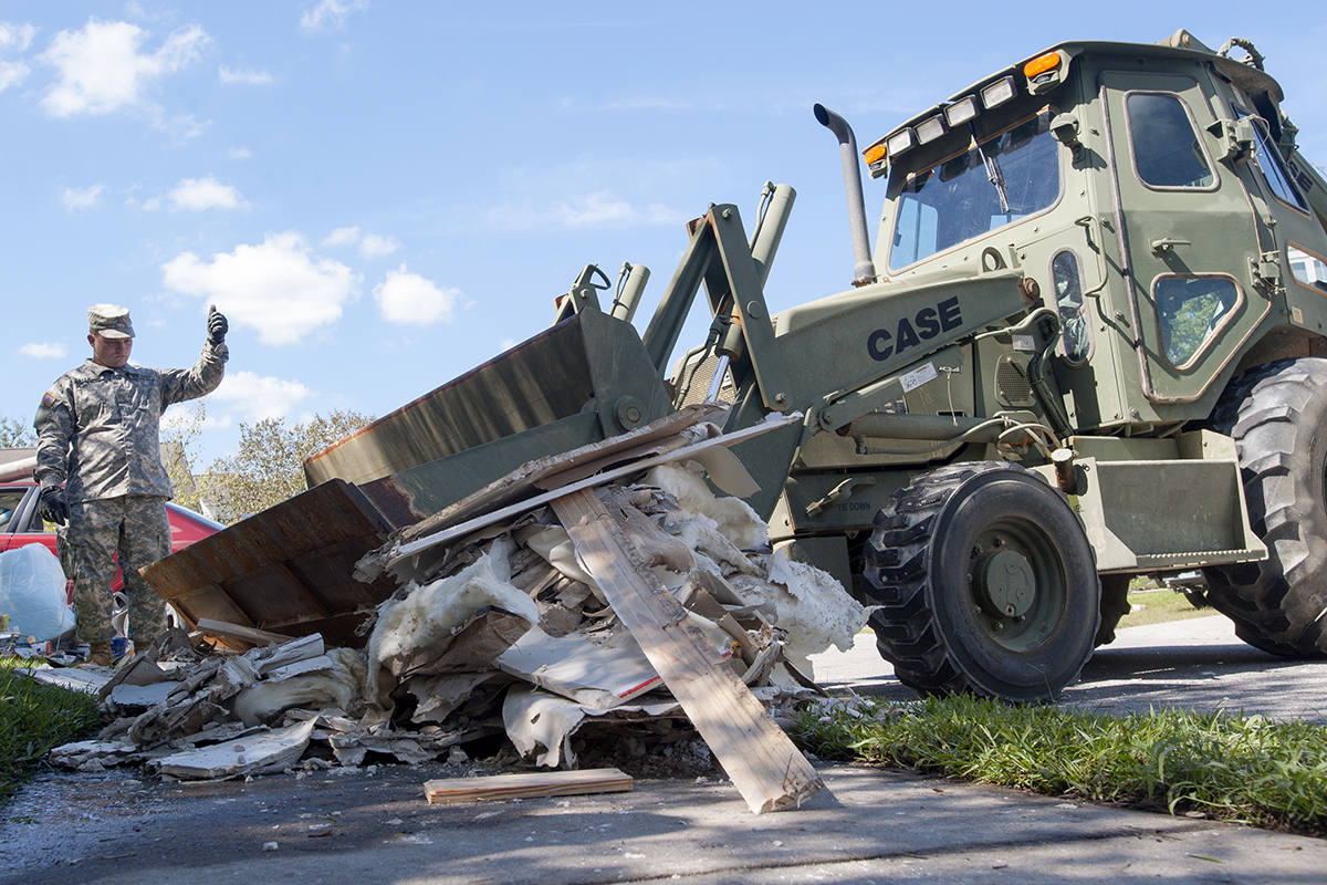 S.C. Army National Guard soldiers help Summerville residents remove debris in 2015 after a historic flood caused property damage and washed out bridges and roads across the state after heavy rains. (Photo/Sgt. Brian Calhoun/U.S. Army National Guard)