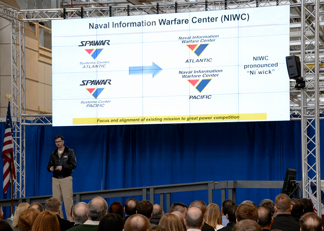 Space and Naval Warfare Systems Command Commander Rear Adm. Christian Becker announces that SPAWAR??s systems centers, SPAWAR Systems Center Atlantic and SPAWAR Systems Center Pacific, will be changing their names to Naval Information Warfare Center Atlantic and Naval Information Warfare Center Pacific during an event at SPAWAR Headquarters. (Photo/Rick Naystatt for the Navy)