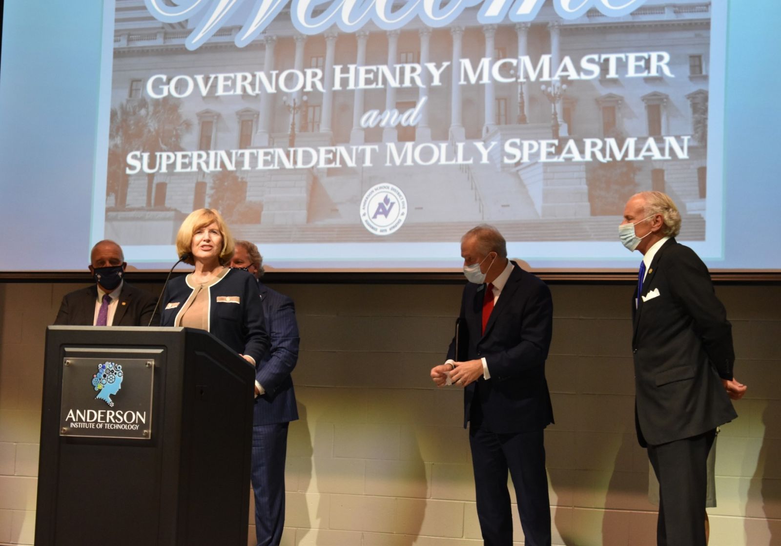 Gov. Henry McMaster looks on as S.C. School Superintendent Molly Spearman gives a speech on PPE distributed to school districts. (Photo/Molly Hulsey)