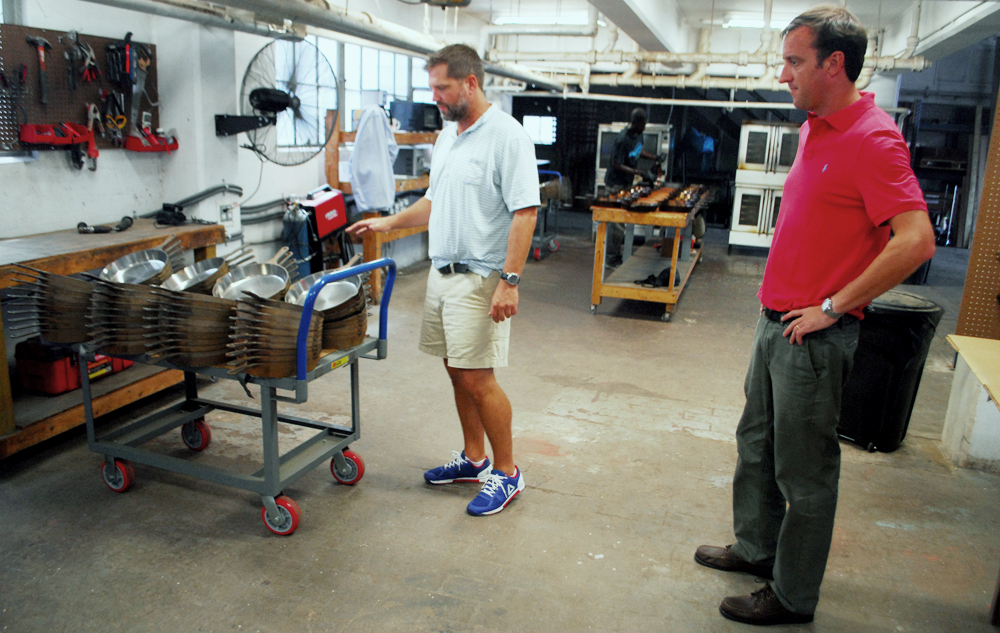 Isaac Morton (left) moved Smithey Ironware Co. to a 5,000-square-foot production site on the former Navy base in North Charleston and hired Will Copenhaver (right) as marketing and sales vice president. (Photo/Andy Owens)