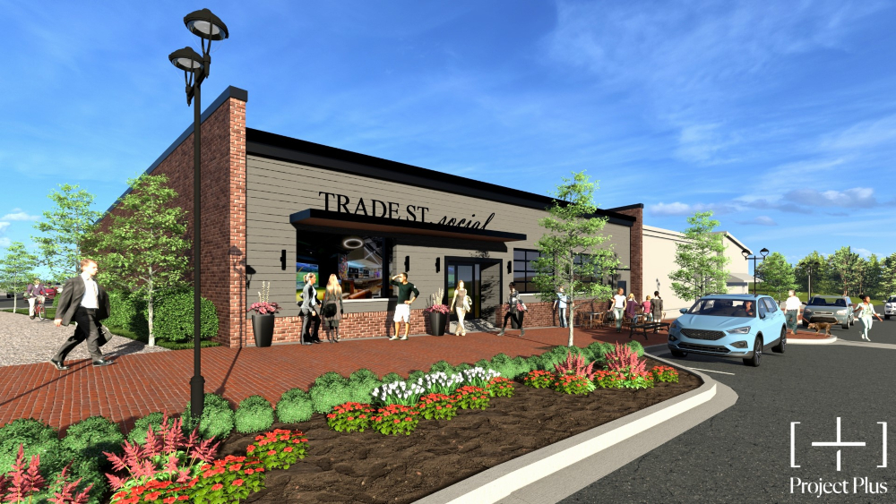 Trade Street Social will focus on entertainment, featuring arcade games, virtual golf and racing simulators, bowling, with a full bar and food menu, patio seating, and roll up doors at the front of the building. (Rendering/Crafted Community Concepts)