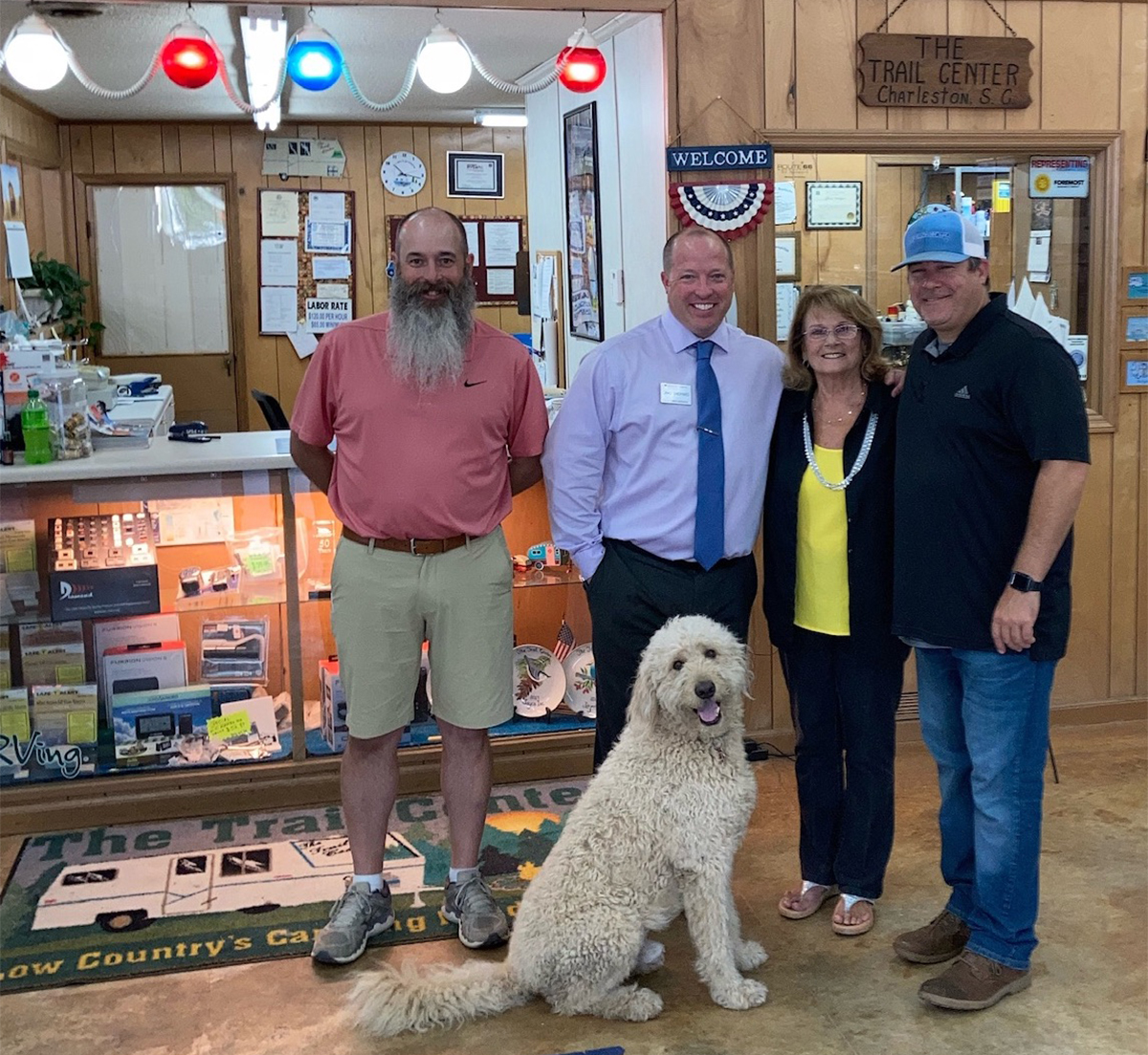 Pete‰ŰŞs RV owners Todd McGinnis and Chad Shepard join Gloria and Jay Morgan, owners of The Trail Center, and their dog Murphy in North Charleston. (Photo/Provided)