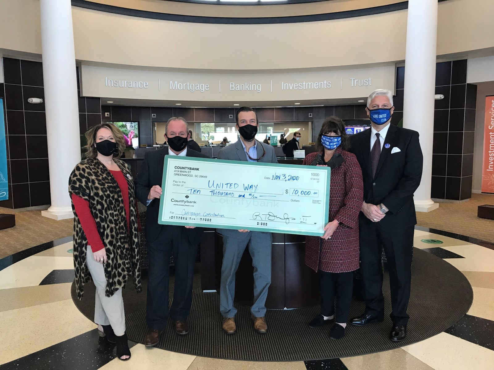 Countybank's Danielle Fields, Tony Lawton and Patrick Craven, United Way's Hannah Gantt and Greenwood Capital's John Cooper pose with the $26,936 donation. (Photo/Provided)