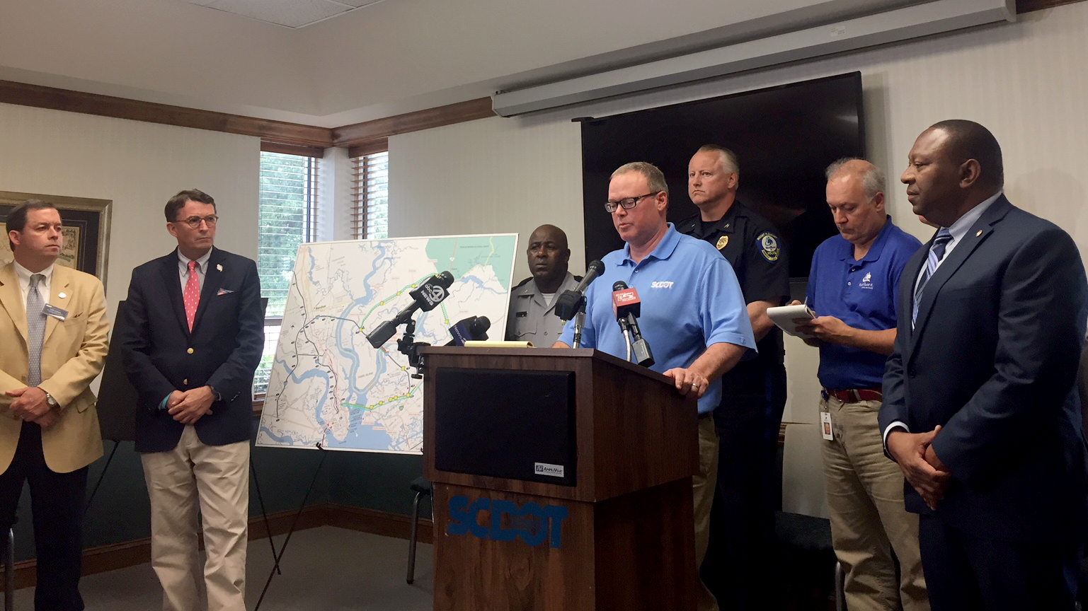 Local and state government and law enforcement officials talk about the status of the Interstate 526 bridge over the Wando River today. (Photo/Liz Segrist)