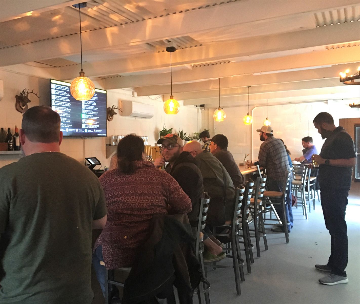Patrons mingle at newly opened bottle shop and tasting room WECO in West Columbia. (Photo/Melinda Waldrop)