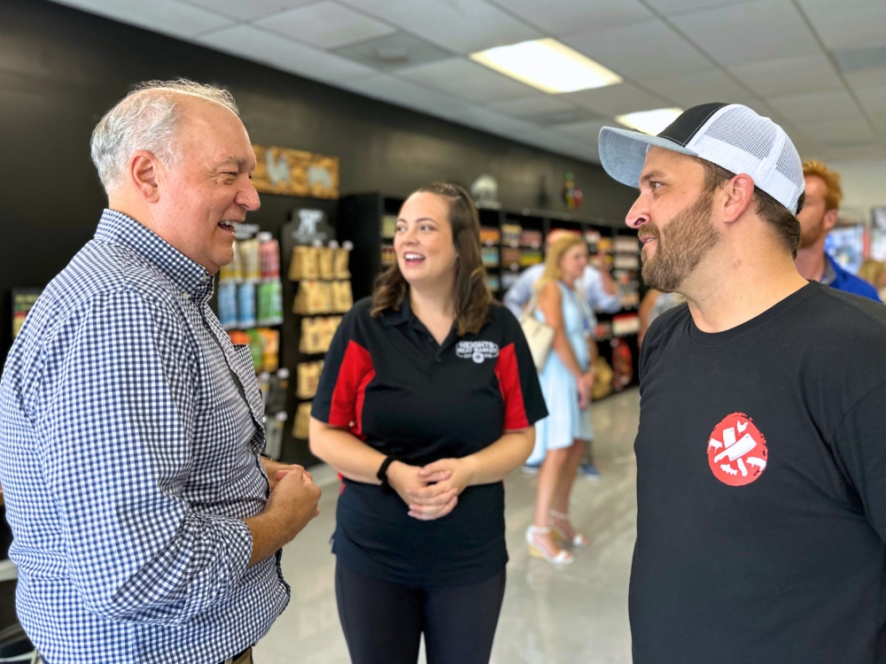 Mount Pleasant Mayor Will Haynie chats with Jeremy and Maddy Park at a ribbon cutting for their business on W. Coleman Boulevard. (Photo/Provided)