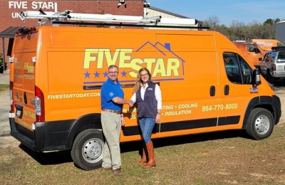 Todd Ramella congratulates Five Star General Manager Ingrid Verseeuw on the purchase of his company. (Photo/Provided)