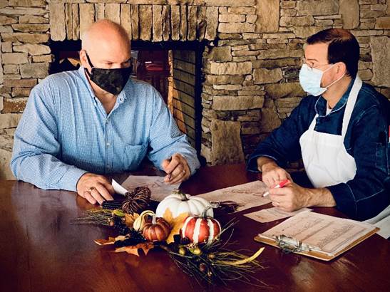 David Szustak general manager of CityRange and Chef Topher Gibbs prepare shopping list for take-out Thanksgiving meal orders. (Photo/Provided)