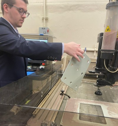 Max Dessington demonstrates how the on-demand manufacturing division of North Charleston-based Naval Information Warfare Center Atlantic makes custom parts for aging war machines. (Photo/Jenny Peterson)