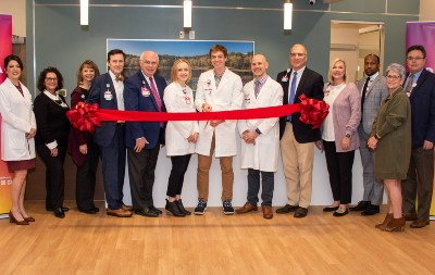 The staff of the Stone & Main practice open the business with a ribbon-cutting ceremony. (Photo/Prisma Health)