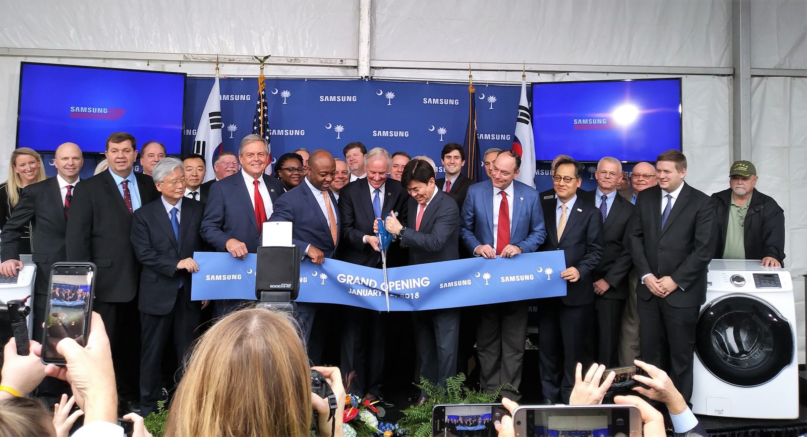 State leaders including Gov. Henry McMaster (center) and U.S. Sen. Tim Scott (left of McMaster) celebrated the grand opening of Samsung's Newberry manufacturing plant on Friday. (Photo/Travis Boland)