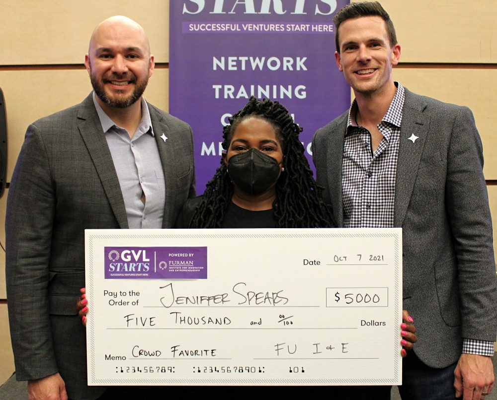 Crowd favorite winner Jennifer Sprears of The African Violet is flanked by Furman Chief Innovation Officer Anthony Herrera and GVL Starts Program Manager Bryan Davis. (Photo/Provided)