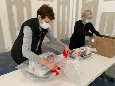 Homes of Hope staff members and volunteers helped unpack the packages of kitchenware donated by Electrolux on Giving Tuesday. (Photo/Provided)