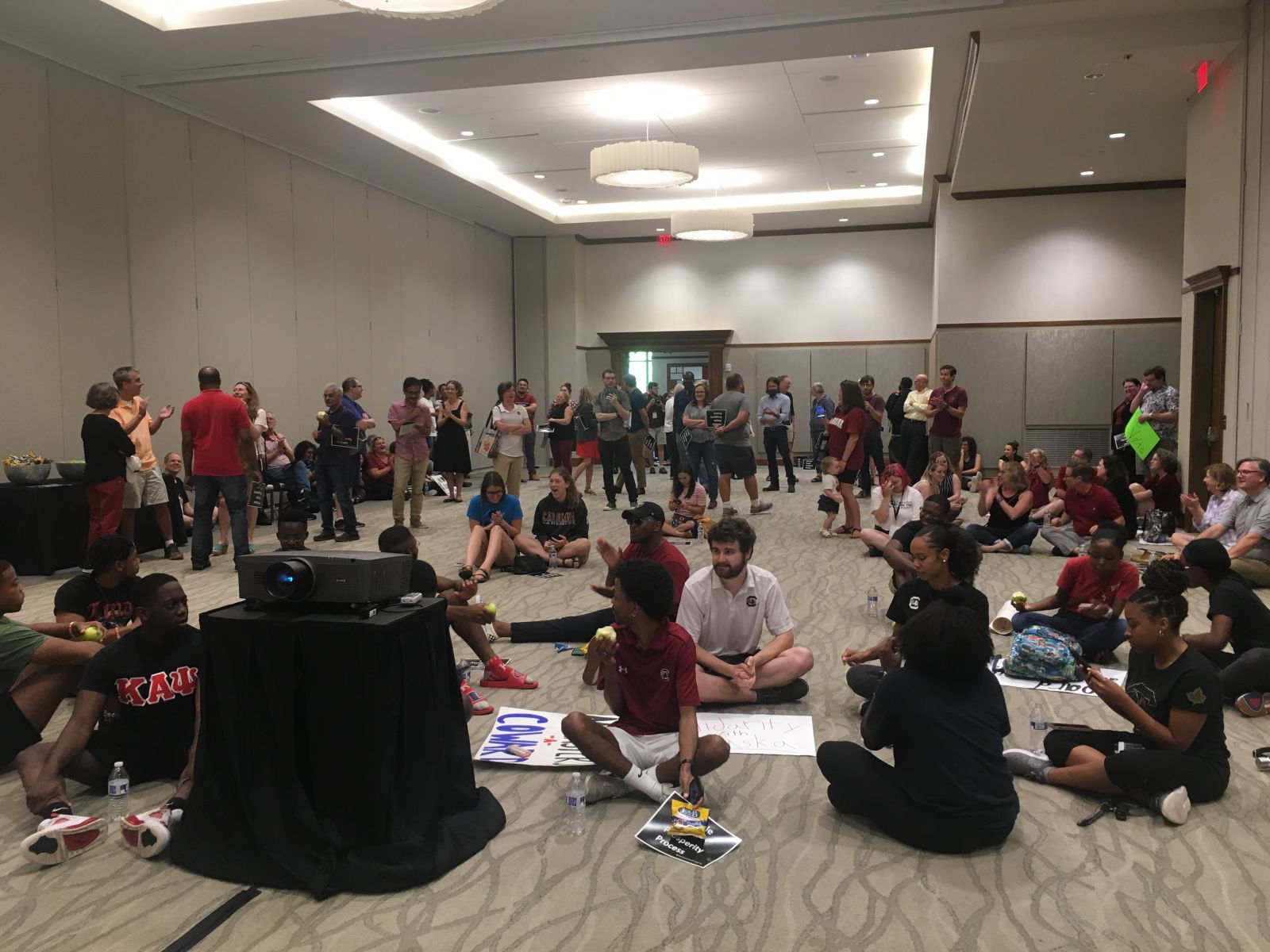 Protesters gather at the Pastides Alumni Center in advance of a contentious University of South Carolina board of trustees vote to elect Robert Caslen the school's new president. (Photo/Renee Sexton)