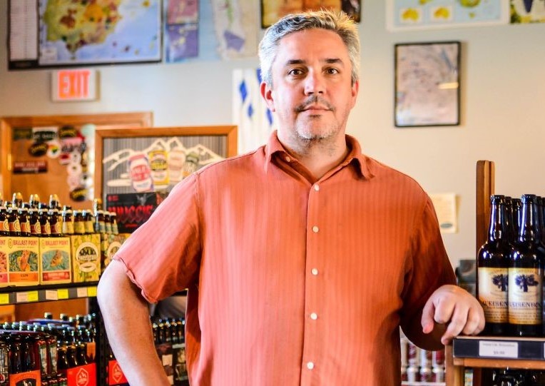 Vino Garage owner Doug Aylard, who relocated his wine shop last fall, says business is continuing at about the same pace as before, though he's had to shift his business model to a 100% retail focus. (Photo/File)